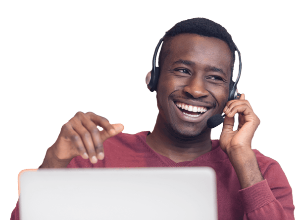 Customer support representative at computer with phone headset