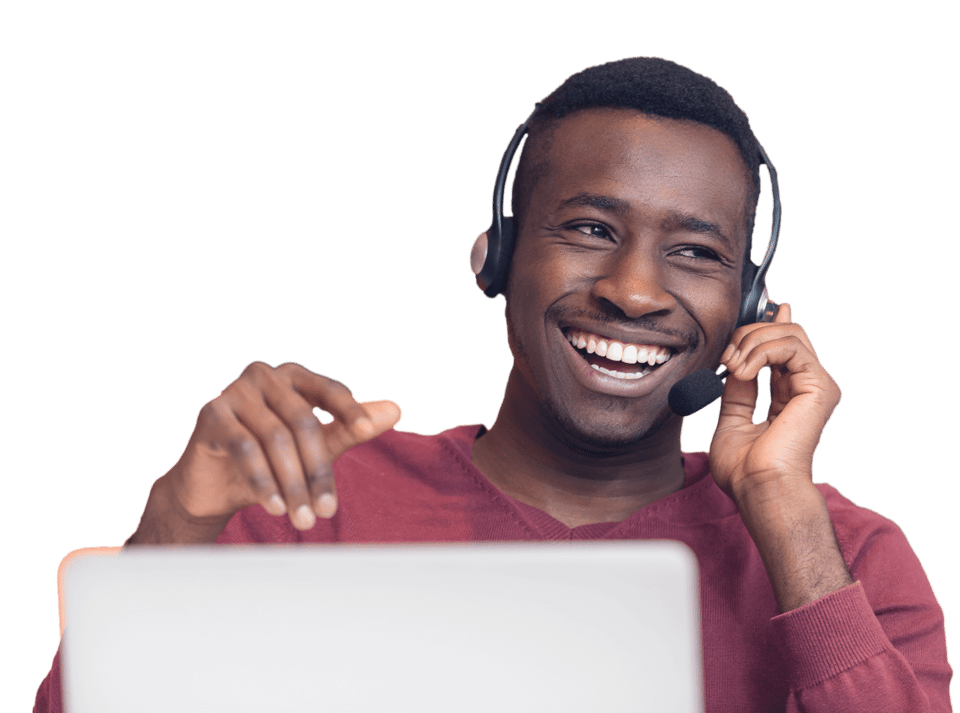Customer support representative at computer with phone headset