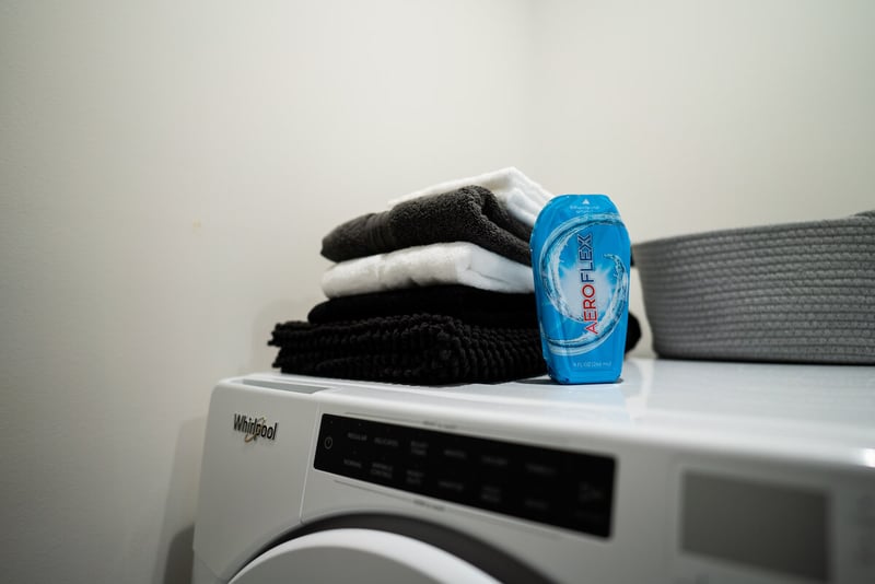 Laundry detergent in an AeroFlexx Pak on top of a washing machine