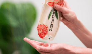 Woman squeezing lotion into her hand