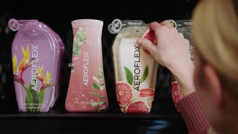 woman grabbing bottle from shelf